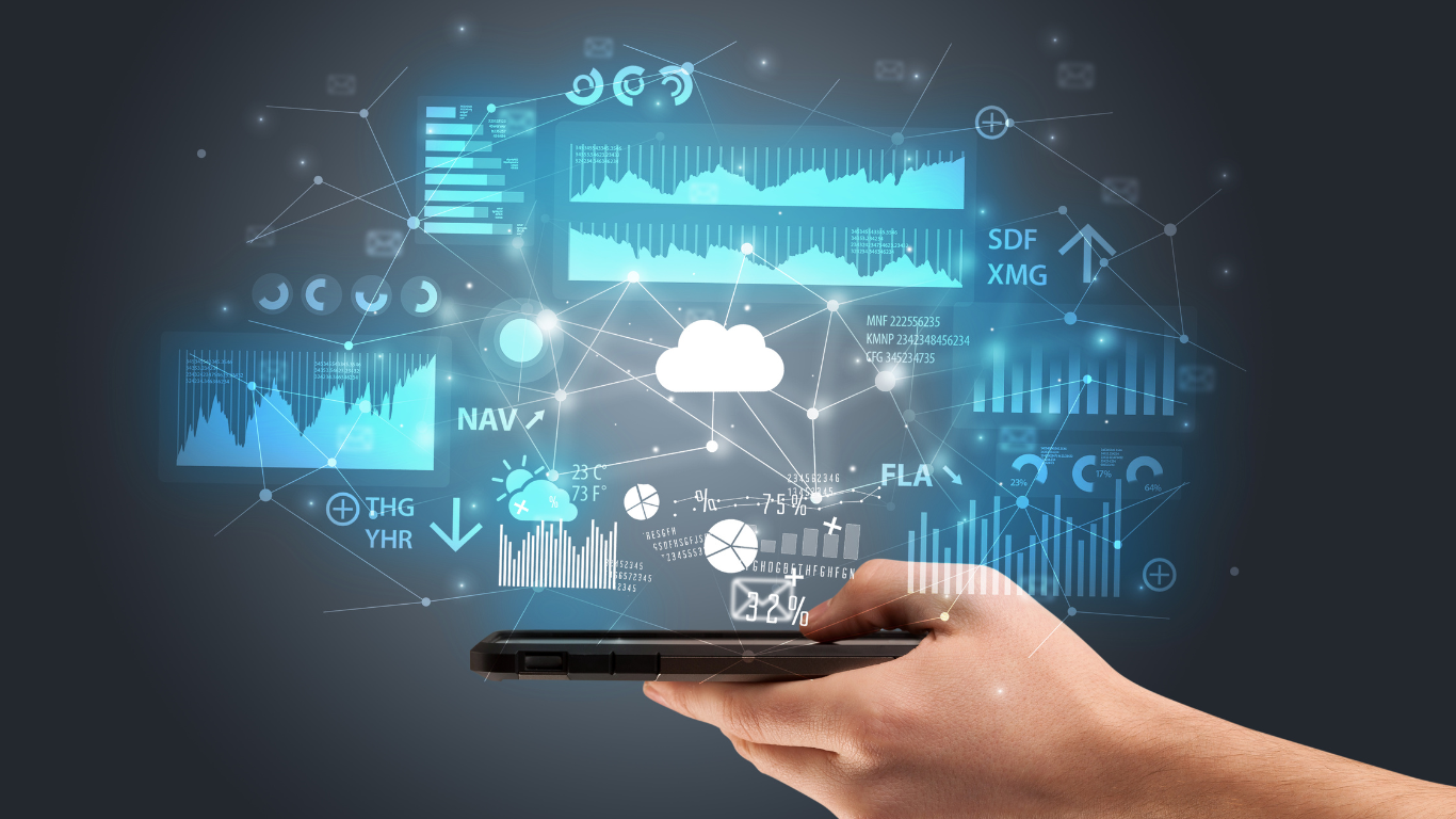 A digitally composited image shows a hand holding a smartphone with holographic data charts, graphs, and icons projected above the screen